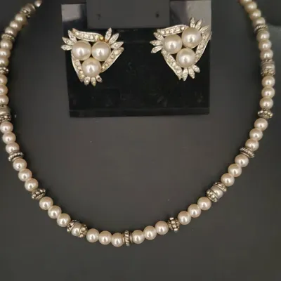 Sale Photo Thumbnail #201: Freshwater Pearl Necklace & Pearl triangle Earrings coord.
> freshwater pearls knotted and space sequentially.....w/ J clasp
> pearl and silver triangle earrings are clip backs