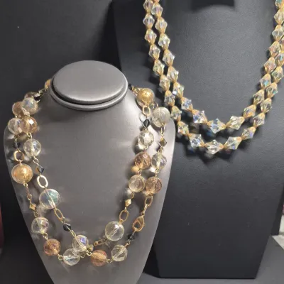 Sale Photo Thumbnail #303: Pair VTG. Aurora Borealis Necklace & Frosted round glass bead [ 2 PCs. ]
> Aurora Borealis beads with gold caps both sides, knotted......22" 
> Frosted round glass gold beads ....knotted.....18"
All stones and beads original to necklaces