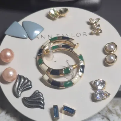 Sale Photo Thumbnail #383: Ann Taylor Sets ~ 2 Necklaces  & 9 pair Earrings
> Necklaces are a silver tone with two spaced Pendants agates w/ tag
> gold tone necklace has small rhinestones sparkling w/ tag
> 9 pair of delicate pairings and an enameled hoop style.... backs  pierced