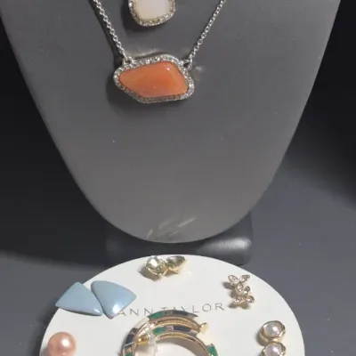 Sale Photo Thumbnail #384: Ann Taylor Sets ~ 2 Necklaces  & 9 pair Earrings
> Necklaces are a silver tone with two spaced Pendants agates w/ tag
> gold tone necklace has small rhinestones sparkling w/ tag
> 9 pair of delicate pairings and an enameled hoop style.... backs  pierced