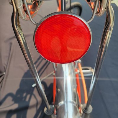 Sale Photo Thumbnail #12: Schwinn Sting-Ray Orange Krate with 5-speed Stik-Shift, springer front fork, high-rise handlebars, orange glitter grips, tall sissy bar, 1990's reproduction schwinn krate banana seat, original white letter slik rear tire, rear reflector, a PAIR of Schwinn