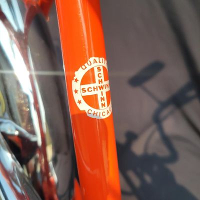 Sale Photo Thumbnail #11: Schwinn Sting-Ray Orange Krate with 5-speed Stik-Shift, springer front fork, high-rise handlebars, orange glitter grips, tall sissy bar, 1990's reproduction schwinn krate banana seat, original white letter slik rear tire, rear reflector, a PAIR of Schwinn