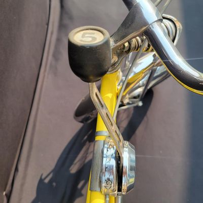 Sale Photo Thumbnail #22: Yellow Schwinn Sting-Ray Lemon Peeler Krate with 5-speed Stik-Shift, springer fork, Wide Tread rear tire, tall sissy bar,1990's reproduction yellow-and-white glitter banana seat, yellow grips and rear reflector. Attractive older frame repaint and decals, 