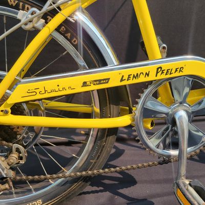 Sale Photo Thumbnail #19: Yellow Schwinn Sting-Ray Lemon Peeler Krate with 5-speed Stik-Shift, springer fork, Wide Tread rear tire, tall sissy bar,1990's reproduction yellow-and-white glitter banana seat, yellow grips and rear reflector. Attractive older frame repaint and decals, 