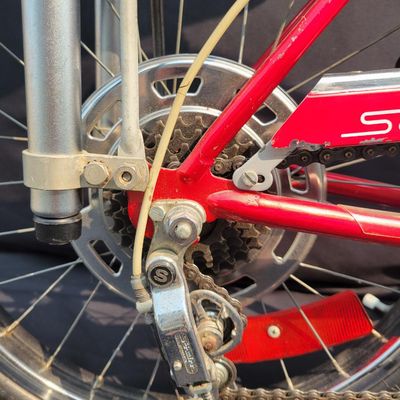 Sale Photo Thumbnail #36: Red Schwinn Sting-Ray Apple Krate with 5-speed Stik-Shift, springer front end, high-rise bars, red grips, tall sissy bar, striped banana seat, front drum-style hub and rear redline slik tire. Complete, well-presented example with normal vintage wear inclu