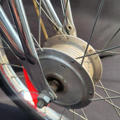 Sale Photo Thumbnail #37: Red Schwinn Sting-Ray Apple Krate with 5-speed Stik-Shift, springer front end, high-rise bars, red grips, tall sissy bar, striped banana seat, front drum-style hub and rear redline slik tire. Complete, well-presented example with normal vintage wear inclu