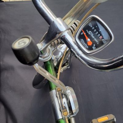 Sale Photo Thumbnail #46: Original Campus Green Schwinn Sting-Ray Pea Picker Krate with 5-speed Stik-Shift, springer fork, green banana seat and grips, tall sissy bar, Schwinn Sting-Ray speedometer/cyclometer and front lighting/reflector accessories. Also fitted with fun display a