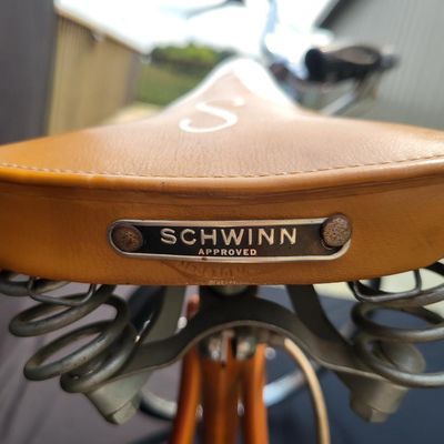 Sale Photo Thumbnail #63: Orange/coppertone Schwinn Collegiate men's multi-speed with full chrome fenders, rear carrier, chainguard, rear reflector, Schwinn grips and brown/cream Schwinn Approved saddle. Largely complete with a great period look. Shows typical age including paint 