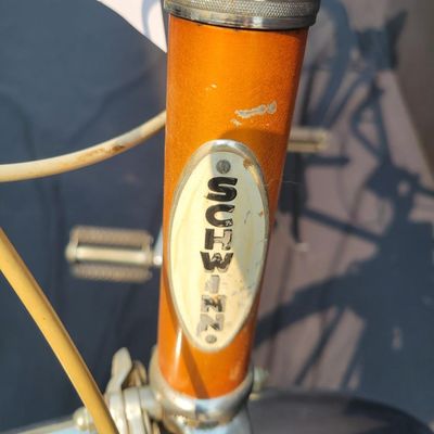 Sale Photo Thumbnail #65: Orange/coppertone Schwinn Collegiate men's multi-speed with full chrome fenders, rear carrier, chainguard, rear reflector, Schwinn grips and brown/cream Schwinn Approved saddle. Largely complete with a great period look. Shows typical age including paint 