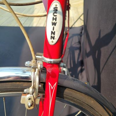 Sale Photo Thumbnail #93: Red Schwinn Speedster men's 3-speed with full fenders, chainguard, black Schwinn saddle and grips, rear reflector and kickstand. Complete, original-style vintage bicycle showing normal paint wear, chrome dulling, surface rust and aged tires. Good candidat