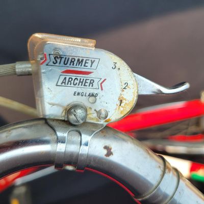 Sale Photo Thumbnail #92: Red Schwinn Speedster men's 3-speed with full fenders, chainguard, black Schwinn saddle and grips, rear reflector and kickstand. Complete, original-style vintage bicycle showing normal paint wear, chrome dulling, surface rust and aged tires. Good candidat