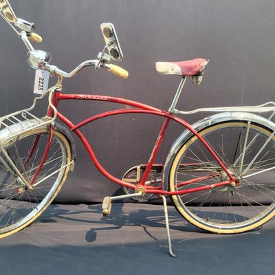 Sale Photo Thumbnail #110: Red Schwinn Corvette loaded with period-style accessories including whitewall tires, full chrome fenders, front and rear carriers, chrome tank insert, red Mesinger-style saddle, bell, headlight, twin front reflectors and cyclometer/control accessories. Ve