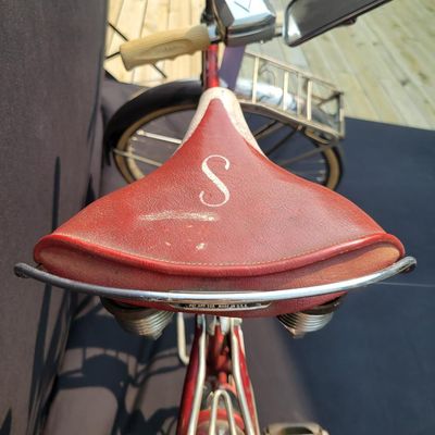 Sale Photo Thumbnail #99: Red Schwinn Corvette loaded with period-style accessories including whitewall tires, full chrome fenders, front and rear carriers, chrome tank insert, red Mesinger-style saddle, bell, headlight, twin front reflectors and cyclometer/control accessories. Ve