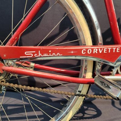 Sale Photo Thumbnail #97: Red Schwinn Corvette loaded with period-style accessories including whitewall tires, full chrome fenders, front and rear carriers, chrome tank insert, red Mesinger-style saddle, bell, headlight, twin front reflectors and cyclometer/control accessories. Ve