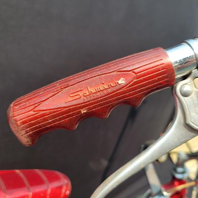 Sale Photo Thumbnail #136: Red Schwinn Deluxe Sting-Ray 3-speed with Deluxe Sting-Ray chainguard, high-rise handlebars, banana saddle, whhitewall Schwinn tires,  sissy bar, front fender and period internal-gear equipment. Honest unrestored condition with paint chips, decal wear, ch