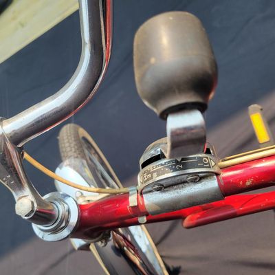 Sale Photo Thumbnail #138: Red Schwinn Deluxe Sting-Ray 3-speed with Deluxe Sting-Ray chainguard, high-rise handlebars, banana saddle, whhitewall Schwinn tires,  sissy bar, front fender and period internal-gear equipment. Honest unrestored condition with paint chips, decal wear, ch