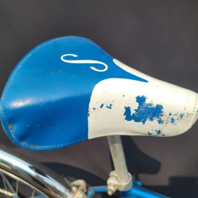 Sale Photo Thumbnail #151: Blue Schwinn Racer men's 3-speed with internal-gear hub, full fenders, blue/white saddle, blue grips and rear reflector. Complete vintage commuter showing normal saddle wear, chrome patina and age to the tires and hardware. Clean, classic Schwinn styling 