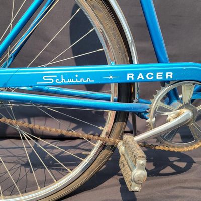 Sale Photo Thumbnail #148: Blue Schwinn Racer men's 3-speed with internal-gear hub, full fenders, blue/white saddle, blue grips and rear reflector. Complete vintage commuter showing normal saddle wear, chrome patina and age to the tires and hardware. Clean, classic Schwinn styling 