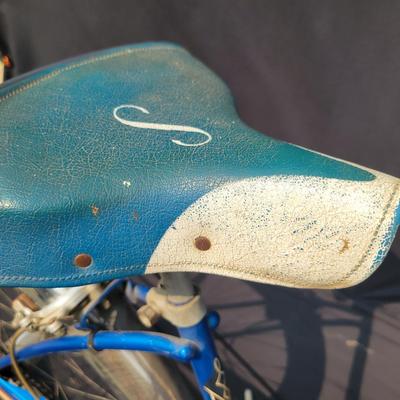 Sale Photo Thumbnail #182: Blue/teal Schwinn Fair Lady 3-speed with whitewall tires, full fenders, front rack, blue/white saddle, cream grips and bell. Complete and attractive vintage step-through bike with plenty of period style. Shows age to the saddle, chrome, spokes and tires a