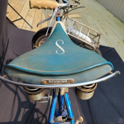 Sale Photo Thumbnail #181: Blue/teal Schwinn Fair Lady 3-speed with whitewall tires, full fenders, front rack, blue/white saddle, cream grips and bell. Complete and attractive vintage step-through bike with plenty of period style. Shows age to the saddle, chrome, spokes and tires a