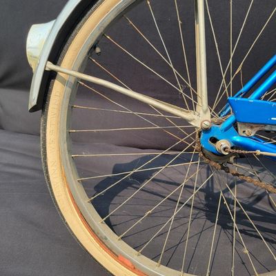 Sale Photo Thumbnail #177: Blue/teal Schwinn Fair Lady 3-speed with whitewall tires, full fenders, front rack, blue/white saddle, cream grips and bell. Complete and attractive vintage step-through bike with plenty of period style. Shows age to the saddle, chrome, spokes and tires a