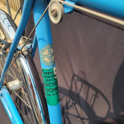 Sale Photo Thumbnail #191: Blue Schwinn Speedster with internal-gear drivetrain, full fenders, rear carrier, black saddle and rear reflector. Complete vintage rider showing paint chips, dull chrome, surface rust and older tires. A straightforward restoration or rider project with c
