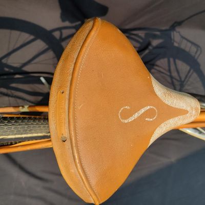 Sale Photo Thumbnail #198: Coppertone/orange Schwinn Corvette with whitewall tires, chrome front fender, missing rear fender, front rack, brown/cream saddle, bell and Corvette chainguard. Attractive survivor with a great original-style look and honest vintage patina. Shows normal p