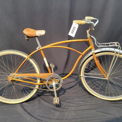 Sale Photo Thumbnail #196: Coppertone/orange Schwinn Corvette with whitewall tires, chrome front fender, missing rear fender, front rack, brown/cream saddle, bell and Corvette chainguard. Attractive survivor with a great original-style look and honest vintage patina. Shows normal p
