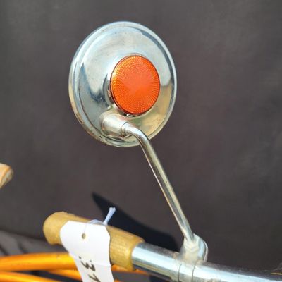 Sale Photo Thumbnail #224: Coppertone/orange Schwinn Corvette II with chrome fenders, front rack, bell/reflector equipment, brown saddle and whitewall tires. Attractive mid-1960s-style survivor with good completeness and plenty of original character. Shows normal paint wear, chrome