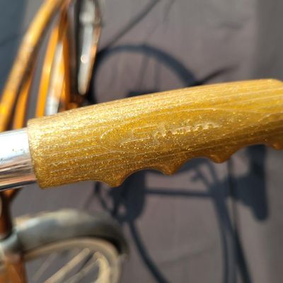 Sale Photo Thumbnail #225: Coppertone/orange Schwinn Corvette II with chrome fenders, front rack, bell/reflector equipment, brown saddle and whitewall tires. Attractive mid-1960s-style survivor with good completeness and plenty of original character. Shows normal paint wear, chrome