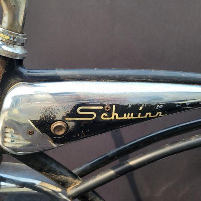 Sale Photo Thumbnail #250: Black Schwinn Panther III with chrome tank, full fenders, rear rack, whitewall tires and black/white saddle. Desirable deluxe Schwinn with excellent display presence and a largely complete configuration. Shows honest age including surface rust, paint wear