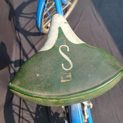 Sale Photo Thumbnail #258: Blue Schwinn Racer women's 3-speed with step-through frame, full fenders, chainguard and green/cream saddle. Complete vintage commuter showing surface rust, paint wear, chrome oxidation and age to the saddle and tires. A good rider-restoration project wit