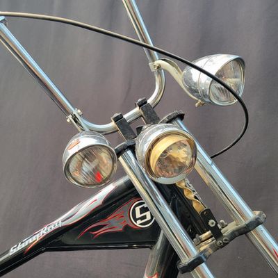 Sale Photo Thumbnail #273: Schwinn Orange County Choppers Sting-Ray in black, red and silver with extended chopper fork, low saddle, rear suspension, ape-style bars, dual mirrors, chrome headlamp and fenders. Complete early-2000s OCC-style bike with strong novelty and collector app