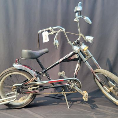 Sale Photo Thumbnail #267: Schwinn Orange County Choppers Sting-Ray in black, red and silver with extended chopper fork, low saddle, rear suspension, ape-style bars, dual mirrors, chrome headlamp and fenders. Complete early-2000s OCC-style bike with strong novelty and collector app
