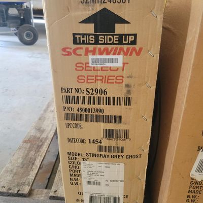 Sale Photo Thumbnail #316: Boxed Schwinn Grey Ghost Sting-Ray factory reproduction, model S2906, with gray finish noted on the Pacific Cycle carton. Modern reissue styled after the 1971 Grey Ghost, not an original vintage example. Bicycle remains boxed/unassembled; carton shows nor