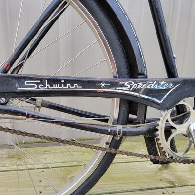 Sale Photo Thumbnail #326: Black Schwinn Speedster men's middleweight with classic cantilever frame, painted fenders, Speedster chainguard, chrome rims, kickstand, Schwinn-style grips and black/white saddle. Honest restoration-project condition with substantial paint loss, surface 