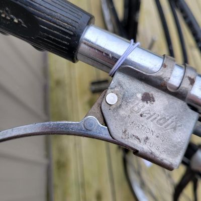 Sale Photo Thumbnail #330: Black Schwinn Speedster men's middleweight with classic cantilever frame, painted fenders, Speedster chainguard, chrome rims, kickstand, Schwinn-style grips and black/white saddle. Honest restoration-project condition with substantial paint loss, surface 