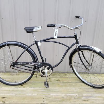 Sale Photo Thumbnail #325: Black Schwinn Speedster men's middleweight with classic cantilever frame, painted fenders, Speedster chainguard, chrome rims, kickstand, Schwinn-style grips and black/white saddle. Honest restoration-project condition with substantial paint loss, surface 