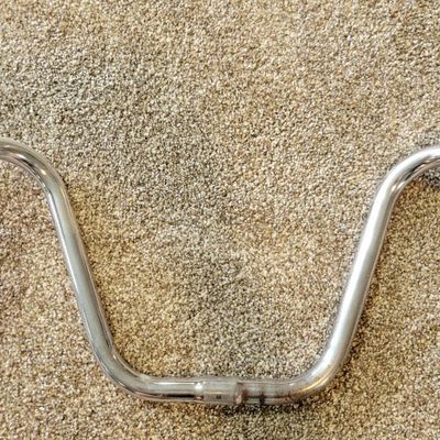 Sale Photo Thumbnail #357: Lot of two chrome cruiser/high-rise bicycle handlebar sets with assorted black grips, both sets are stamped SCHWINN. One set is Stamped SCHWINN RAMSHORN. Used condition with scratches, grip wear and light chrome patina. Good parts lot for cruiser, muscle-