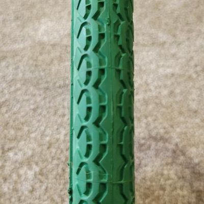 Sale Photo Thumbnail #375: Pair of vintage Goodyear green bicycle tires,Front Wingfoot size 20 x 1.75, and Rear Grasshopper Slick size 20 x 2.125 with contrasting orange/red sidewall stripe. Sidewalls are marked GOODYEAR and POLYESTER. Great visual fit for a vintage muscle-bike, cu