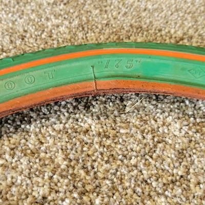 Sale Photo Thumbnail #377: Pair of vintage Goodyear green bicycle tires,Front Wingfoot size 20 x 1.75, and Rear Grasshopper Slick size 20 x 2.125 with contrasting orange/red sidewall stripe. Sidewalls are marked GOODYEAR and POLYESTER. Great visual fit for a vintage muscle-bike, cu