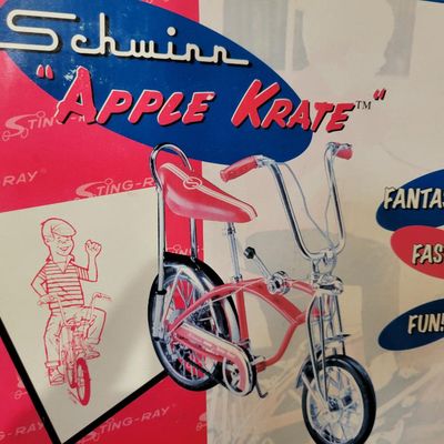 Sale Photo Thumbnail #394: Boxed Xonex 1:6 scale Schwinn Sting-Ray Apple Krate die-cast model in red with molded Styrofoam insert and original presentation carton. Nicely detailed miniature with banana seat, tall bars and Krate-style front end. Model presents well; box shows normal