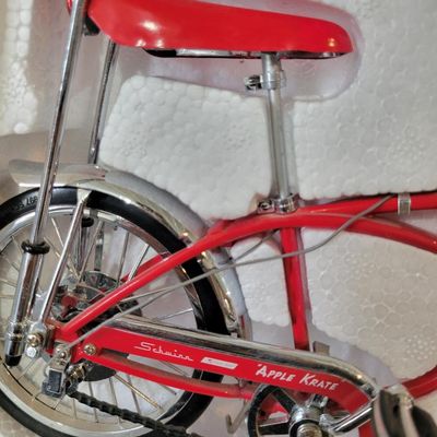 Sale Photo Thumbnail #396: Boxed Xonex 1:6 scale Schwinn Sting-Ray Apple Krate die-cast model in red with molded Styrofoam insert and original presentation carton. Nicely detailed miniature with banana seat, tall bars and Krate-style front end. Model presents well; box shows normal