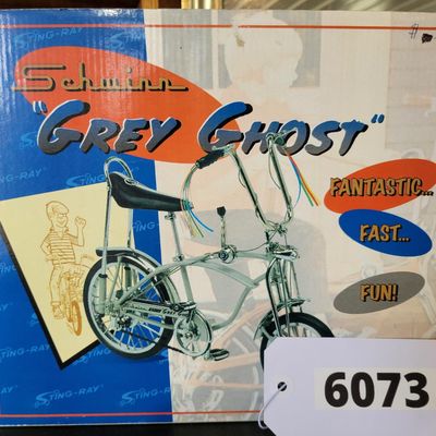 Sale Photo Thumbnail #398: Boxed Xonex 1:6 scale Schwinn Sting-Ray Grey Ghost Krate die-cast model in silver/gray with black-and-silver banana seat and detailed Krate styling. Includes molded Styrofoam insert and original Grey Ghost presentation carton. Model presents well with exp