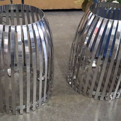 Sale Photo Thumbnail #396: Pair of Modernist Slatted Stainless Steel Barrel-Form Side Tables/Pedestals