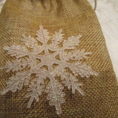 Sale Photo Thumbnail #43: 3 Furies ornaments, 1 wreath, 1 envelope/wrapping paper cutter, truck pick, 3 bead clips wreath hanger, 2  egg nativity ornaments, set of 12 miniature ornaments, Santa hat size Medium, 2 doves with a poem in a burlap bag, 1 snowflake,  see pictures