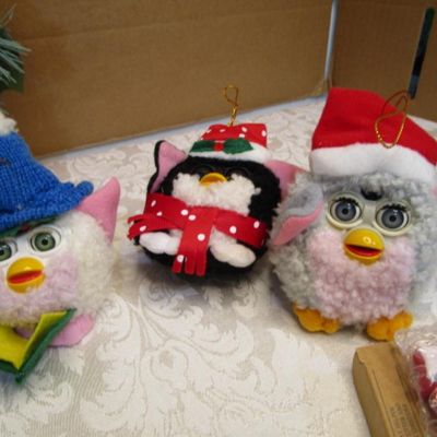 Sale Photo Thumbnail #40: 3 Furies ornaments, 1 wreath, 1 envelope/wrapping paper cutter, truck pick, 3 bead clips wreath hanger, 2  egg nativity ornaments, set of 12 miniature ornaments, Santa hat size Medium, 2 doves with a poem in a burlap bag, 1 snowflake,  see pictures