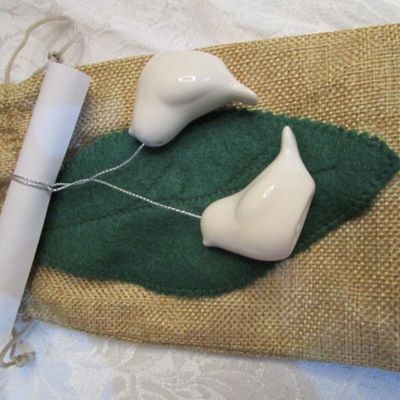 Sale Photo Thumbnail #32: 3 Furies ornaments, 1 wreath, 1 envelope/wrapping paper cutter, truck pick, 3 bead clips wreath hanger, 2  egg nativity ornaments, set of 12 miniature ornaments, Santa hat size Medium, 2 doves with a poem in a burlap bag, 1 snowflake,  see pictures