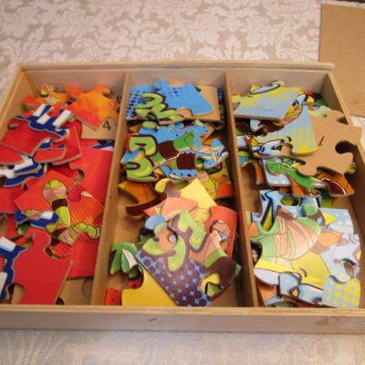 Sale Photo Thumbnail #327: Like new, 1 puzzle has 24 pieces, 2 have 16 pieces, and 2 have 12 pieced, each piece of the puzzles is numbered on the back, see pictures