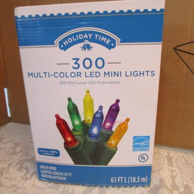 Sale Photo Thumbnail #620: Star wreath frame is 15" across, one new string of multi-color mini lights has 50 bulbs, one new string of clear mini lights has 50 bulbs, new in box 300 multicolor mini lights, 1 new in box string 35 blue mini lights, see pictures
